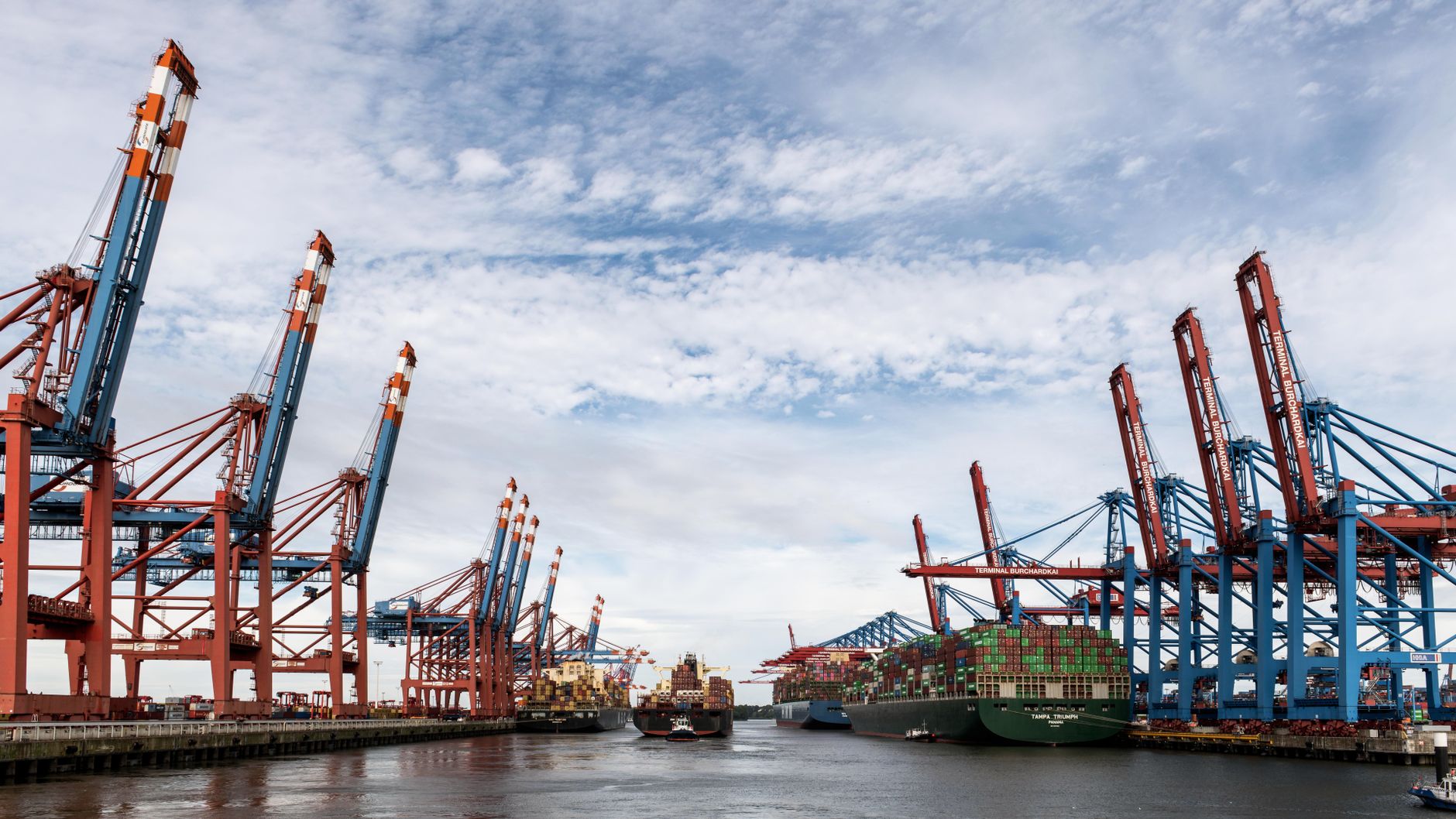 Container terminal at Mundra port with stacked shipping containers at dawn